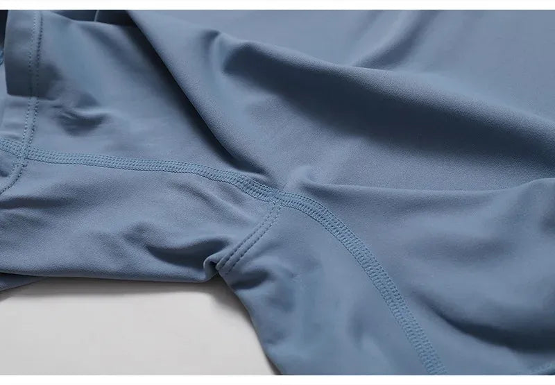 Macacão manga curta com zíper Azul